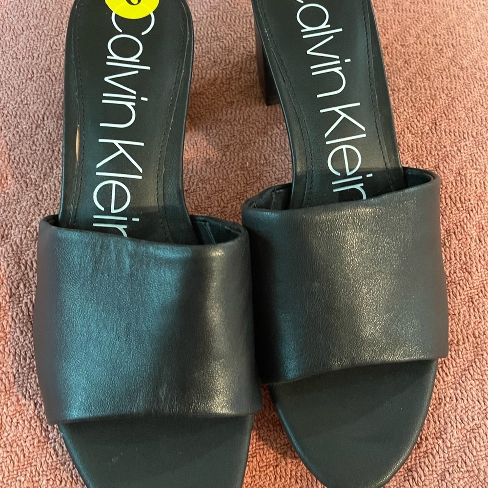 Calvin Klein slide-on style sandals.